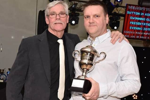 Gren Greaves presenting the new trophy to the club's head coach, Lee Bunker. (PHOTO BY: Brian Hall)