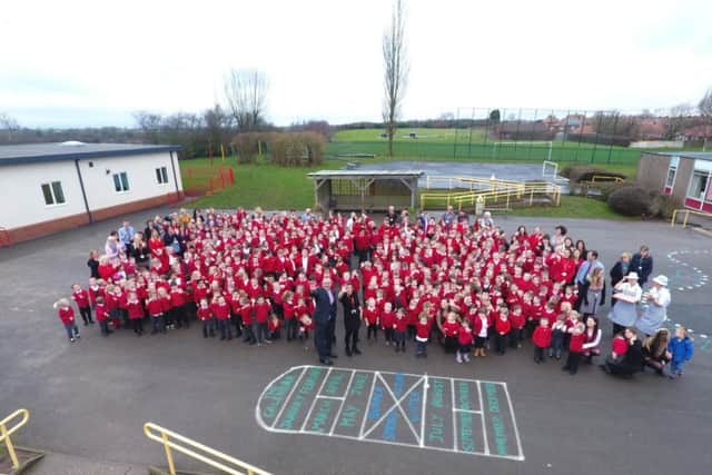 Staff and pupils at Crescent Primary School celebrate their outstanding Ofsted rating