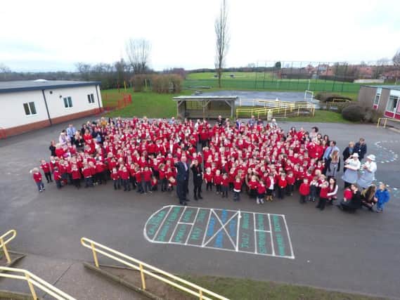 Staff and pupils at Crescent Primary School celebrate their outstanding Ofsted rating