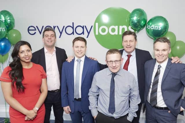 Branch manager Daniel de Quincey (third left), managing director Jon Wiggins (second left) and the Everyday Loans team at Mansfield.