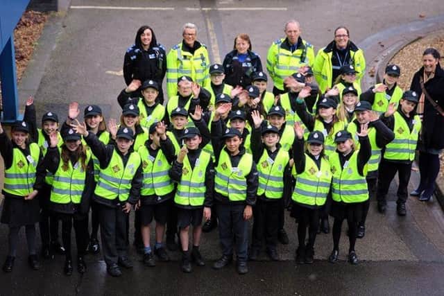 Nottinghamshire Mini Police members, including youngsters from Mansfield's High Oakham Primary School, celebrate the youth scheme's first anniversary.