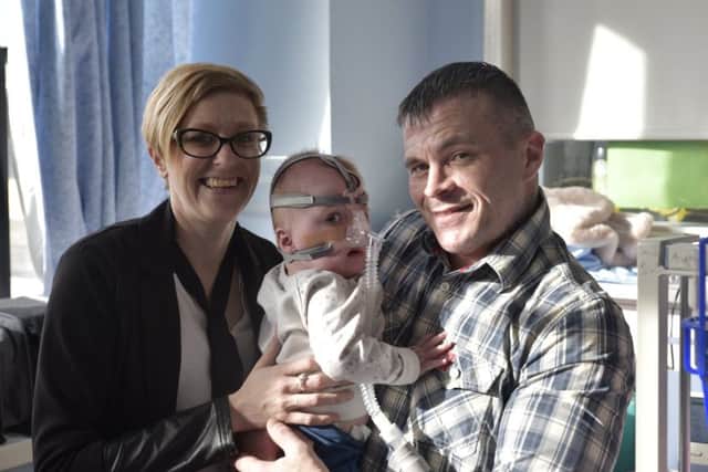 Vanellope Hope Wilkins, with her parents Naomi and Dean