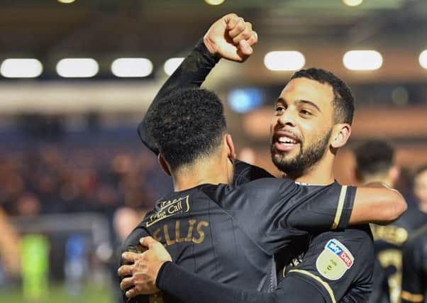 Mansfield Town's CJ Hamilton and Jacob Mellis celebrate their sides great comeback win after the game: Picture by Steve Flynn/AHPIX.com, Football: Skybet League Two  match Colchester United -V- Mansfield Town at JobServe Community Stadium, Colchester, Essex, England on copyright picture Howard Roe 07973 739229