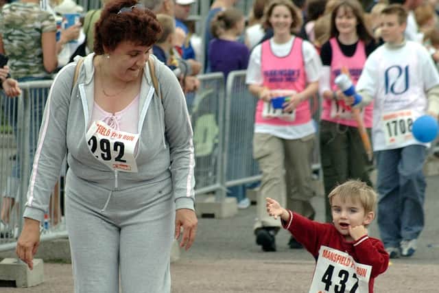 2003: A fabulous shot from Mansfields fun run. This little boy is enjoying it. Are you on this picture?