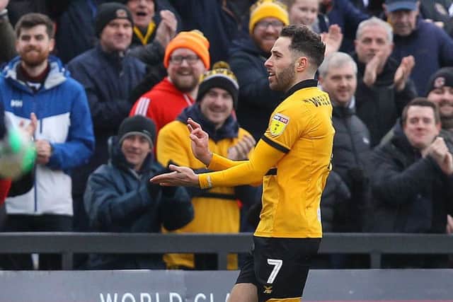 County's Robbie Willmott celebrates his new contract with the opening goal against Mansfield.