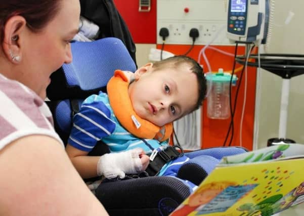 George Appleyard, four, enjoys story time.