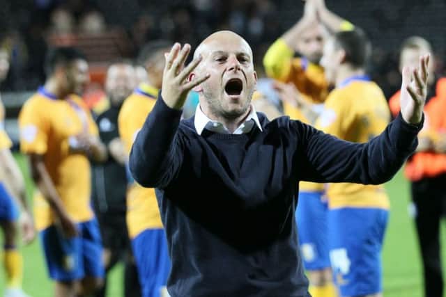 Mansfield manager Adam Murray celebrates the win at local rivals Notts County - Pic by: Richard Parkes