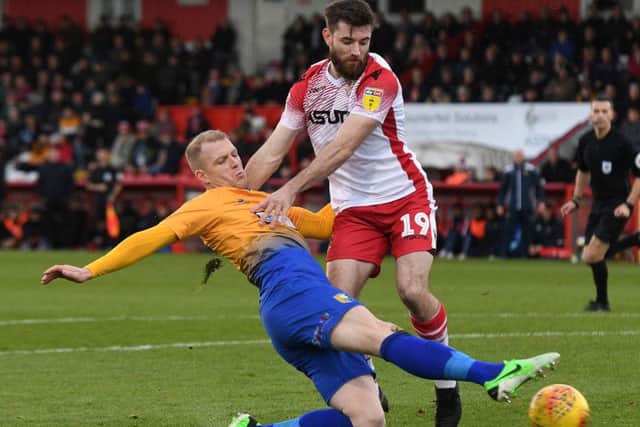 Mansfield's Neal Bishop battles with Stevenage's Danny Newton