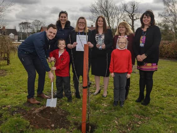 Forest Town Primary recieved a quality mark award from Nurture Group Network, pictured helping to plant a tree to mark the occasion is MP Ben Bradley with Nurture Group's Elisa Mascellani, assistant headteacher Laura Leedham, deputy headteacher, Nicola Lomas, Dinah Bishop and Jackie Whitaker
