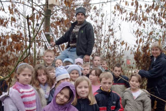 2002: Pupils from Robert Jones School in Blidworth are busy tree planting. Do you recognise anyone?