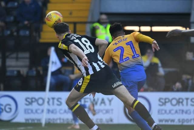 Nicky Ajose has an attempt on goal for the Stags.