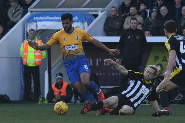 Picture by Howard Roe/AHPIX.com;Football;Skybet;
Notts County v Mansfield Town
16/2/2019 KO 1.00pm; Meadow Lane;
copyright picture;Howard Roe;07973 739229
Stag's Jacob Mellis challenged by Countys Craig Mackail-Smith