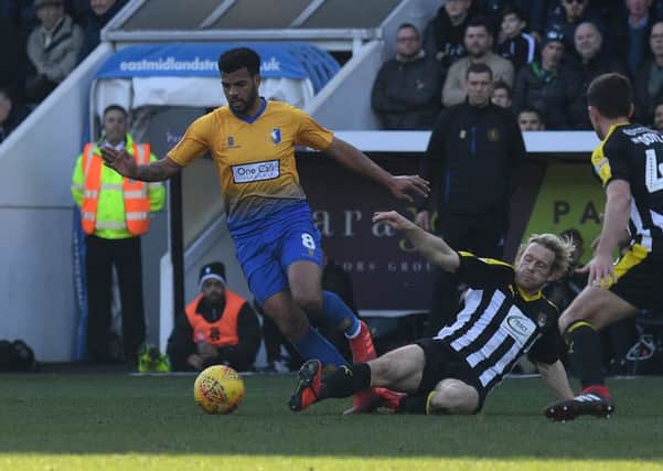 Picture by Howard Roe/AHPIX.com;Football;Skybet; 
Notts County v Mansfield Town
16/2/2019  KO 1.00pm; Meadow Lane;
copyright picture;Howard Roe;07973 739229

Stag's Jacob Mellis challenged by Countys Craig Mackail-Smith