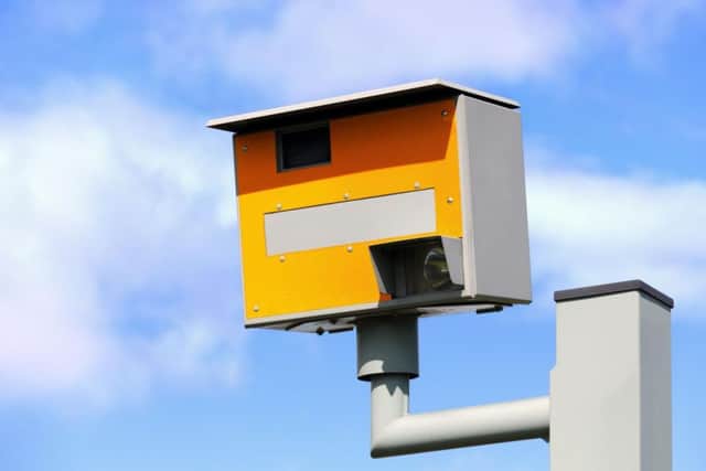 These are the 'classic' standard speed cameras which have been on roads since the 1990s. They are rear facing and capture the car and number plate when driven past fast enough to trigger it.