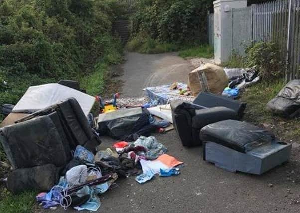 Fly tipping near the railway footbridge at Kirkby, pic by Toby Alexander Metcalf.