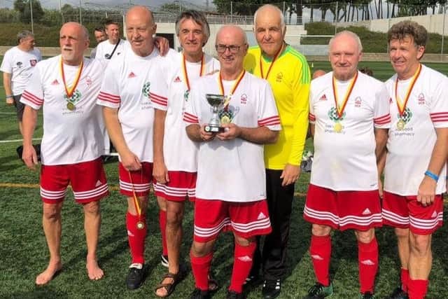 Mansfield Senior Reds Over-50s walking football team after winning a trophy in Spain last year.