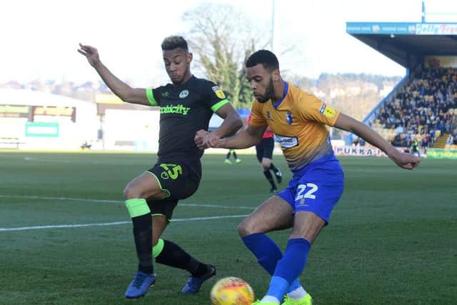 CJ Hamilton crosses against Forest Green.