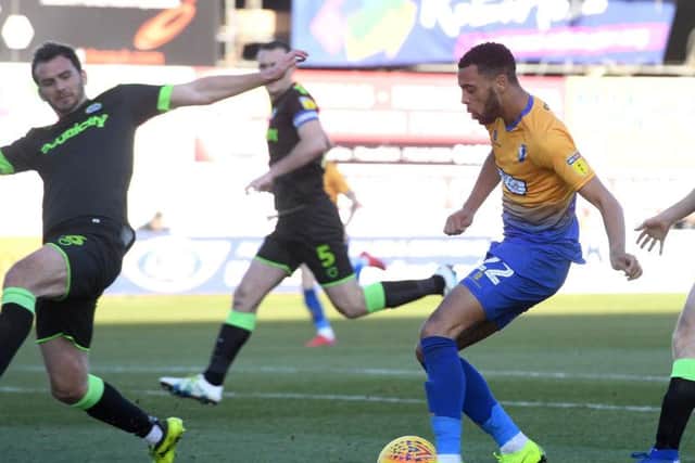 CJ Hamilton crosses against Forest Green.