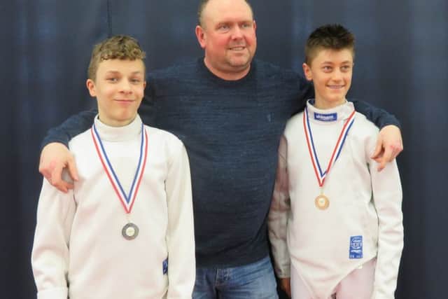 Coach Miroslaw Poplawski with medallists Sebastian Sluja (right) and Maksymilian Palamar.