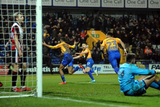 Mansfield Town v Cheltenham Town.
CJ Hamilton turns to take the applause after his stoppage time match winning goal at The One Call Stadium last season