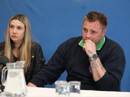 Kelly and Danny Peat appearing at a police press conference in 2015.