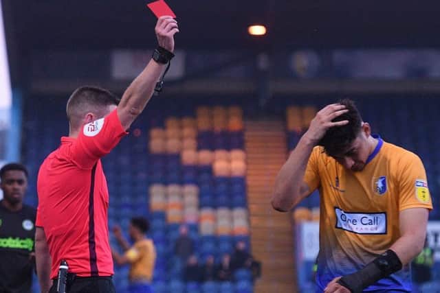 Mansfield's Tyler Walker is sent off by referee Matthew Donohue.