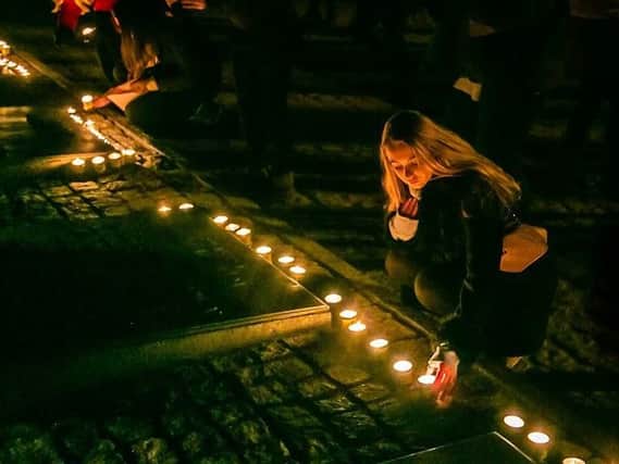 Students light candles. Taken by Yakir Zur