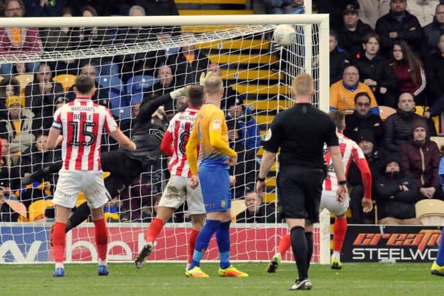 Cheltenham pull one back from a free kick.