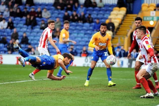 Will Atkinson scores with a diving header to put the Stags back in front.