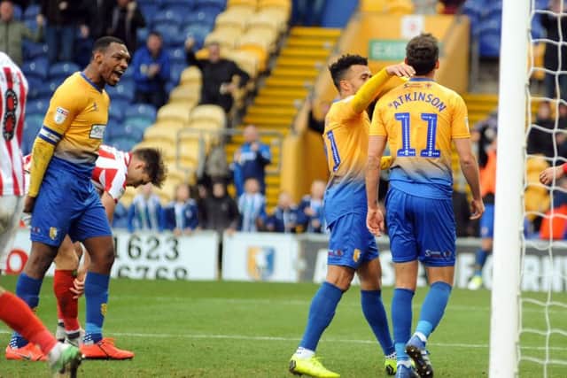 The Stag's captain, Krystian Pearce, shouts his approval at goal-scorer Will Atkinson.