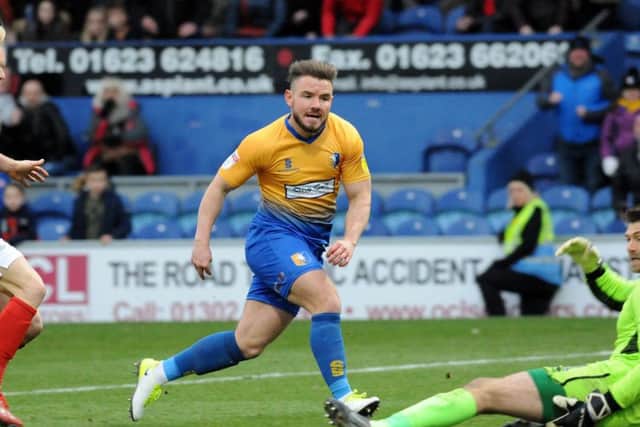 Alex MacDonald slots in Mansfield's fourth goal of the afternoon.