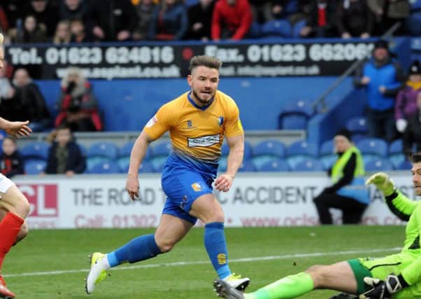 Alex MacDonald slots in Mansfield's fourth goal of the afternoon.