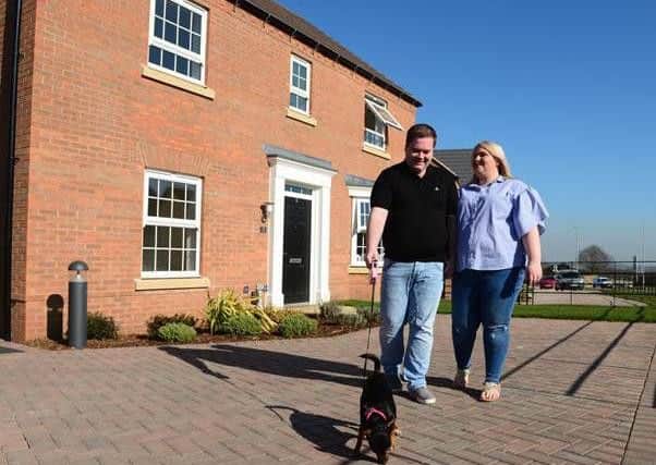 Jordan and Victoria outside of their new home at Berry Hill.