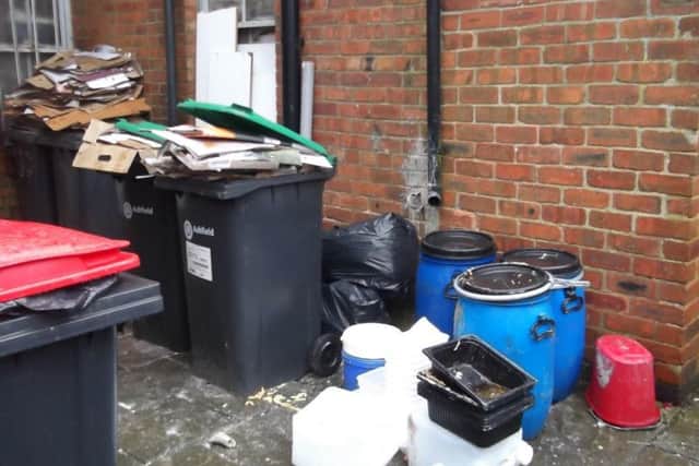 The rubbish area of 1stClass Chicken.