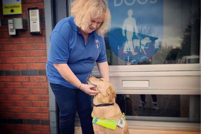 Mel Griffiths with guide dog Hudson