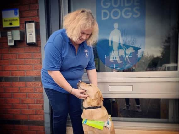Mel Griffiths with guide dog Hudson