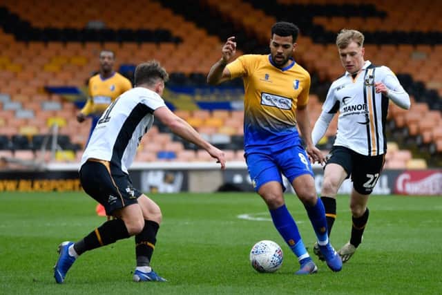 Mansfield Town's Jacob Mellis runs at the Vale defence.