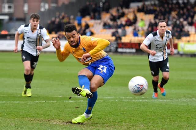 Mansfield Town's Nicky Ajose takes his penalty that was saved by Port Vale goalkeeper Scott Brown.