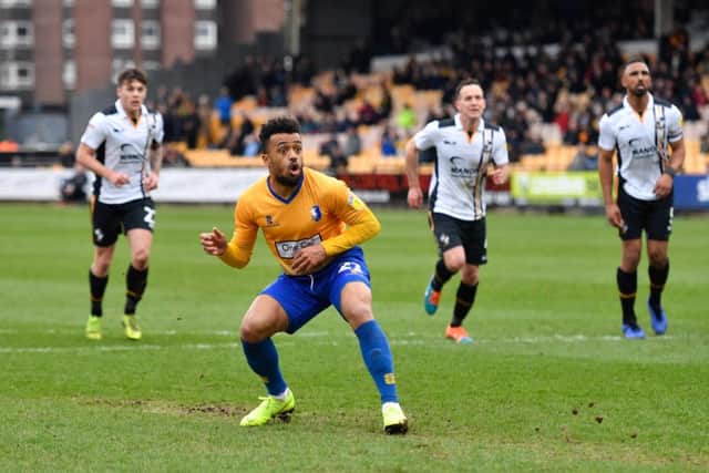 Mansfield Town's Nicky Ajose looks on as his penalty is saved.