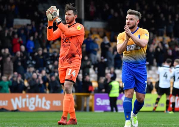Mansfield Town's Alex MacDonald and Jordan Smith salute the travelling Stags fans after their defeat: Picture by Steve Flynn/AHPIX.com, Football: EFL League 2 match Port Vale -V- Mansfield Town at Vale Park, Burslem, Staffordshire, England on 09/03/2019: copyright picture Howard Roe 07973 739229