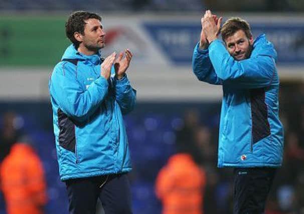 Danny Cowley manager of Lincoln City  and his brother and assistant manager Nicky Cowley.