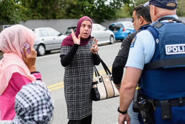 Members of the public react in front of the Masjd Al Noor Mosque as they fear for their relatives on March 15, 2019 in Christchurch, New Zealand.