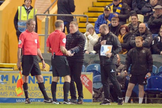 Mansfield Town v Lincoln City.
David Flitcroft has words with referee Graham Scott.