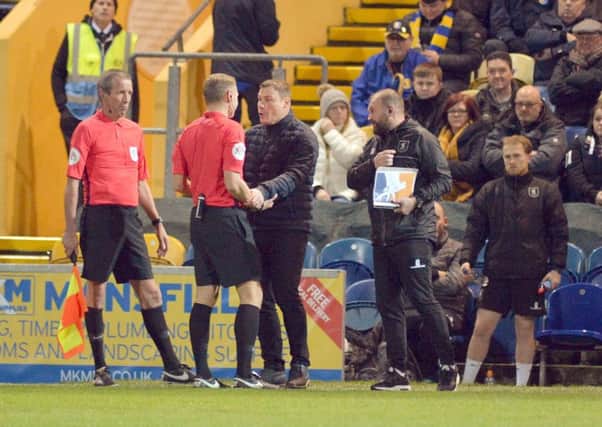 Mansfield Town v Lincoln City.
David Flitcroft has words with referee Graham Scott.