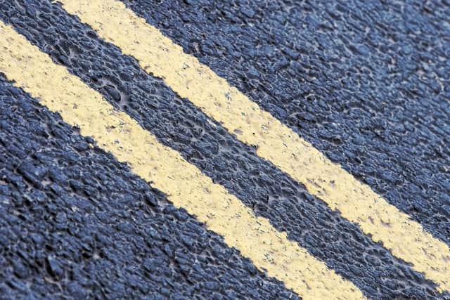 Two yellow lines mean parking and waiting is not permitted at any time, and they can either be painted on the road or the kerb.