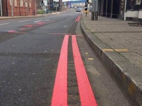 Two red lines painted on the kerb or road state that drivers must not stop at any time, unless a licensed taxi or blue badge holder who can drop off/pick up passengers only.