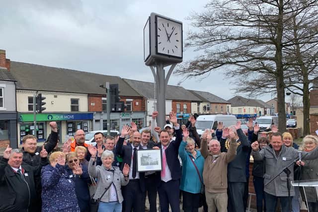 Residents and councillors celebrate the opening of the clock.