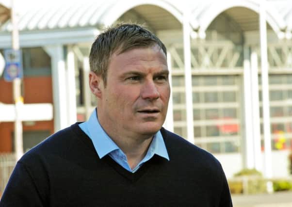 David Flitcroft in his shirt and jumper that saw him mistaken for security staff at Tesco.