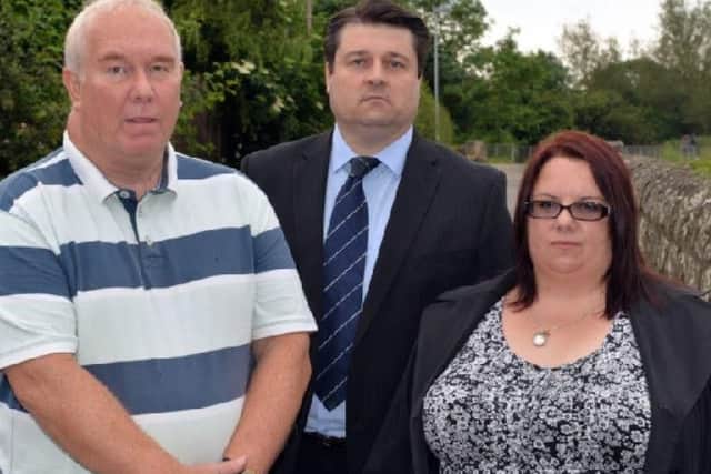 The family of Phil Dawn and councillors are campagining for a bridge over the level crossing near Kings Mill reservoir. Pictured are John Dawn, Coun Darren Langton and Phil's sister Tracy Hart.