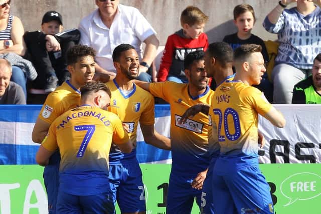 Celebrations after the first of CJ Hamilton's two first-half goals.